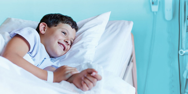 Boy in hospital bed