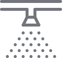 a gray icon of a shower with dots on a black background.